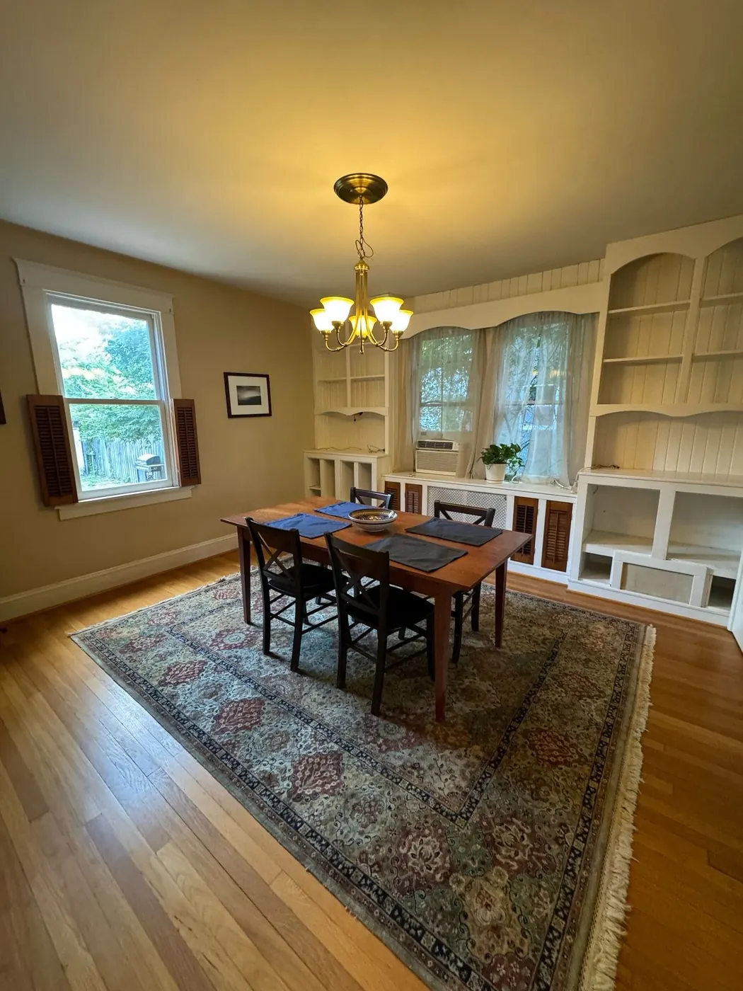 Clean dining room with polished hardwood floors after residential cleaning service in Richmond, Virginia
