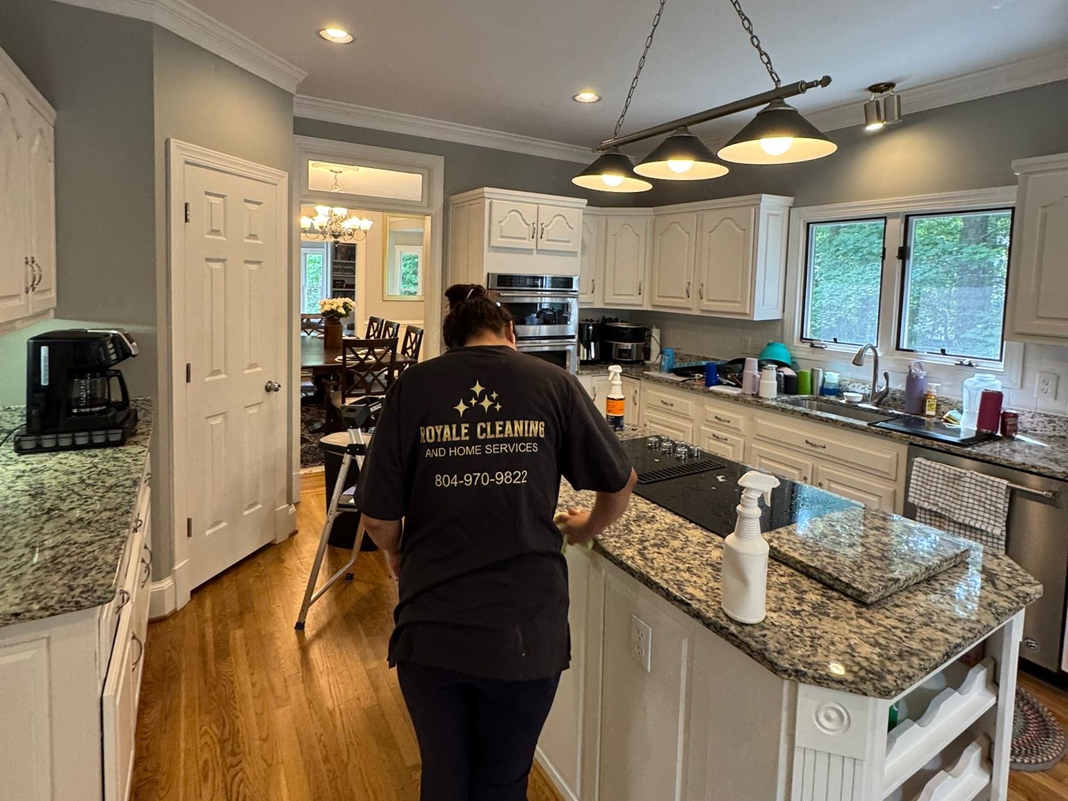 Royale Cleaning team member cleaning a kitchen in Greater Richmond, Virginia